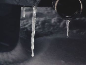 Close-up of faucet in water