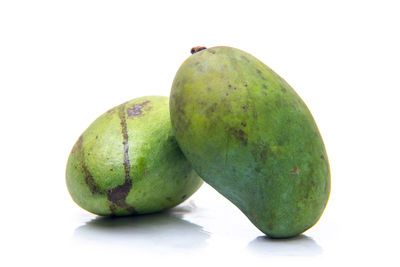 Close-up of fruit against white background