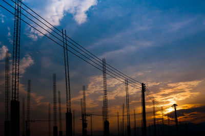 Construction site view of scaffolding poles on building site sunset