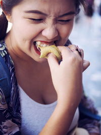 Close-up of woman eating food