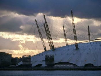 View of cranes at sunset