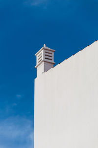 Low angle view of building against blue sky