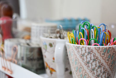 Close-up of multi colored glass on table