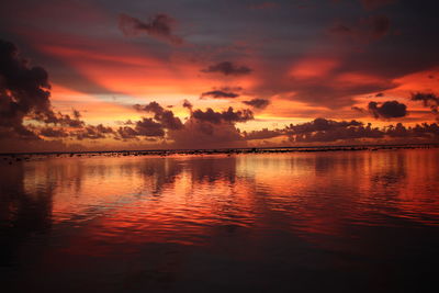 Scenic view of lake against orange sky