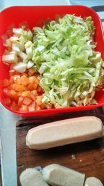 High angle view of chopped vegetables in bowl on table