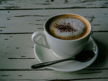 Close-up of coffee cup on table