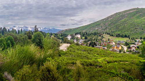 Panoramic view of trees and buildings against sky