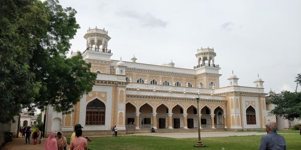 Group of people in front of historical building