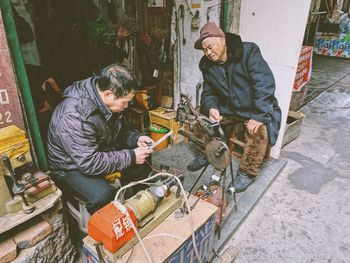 People working on wall