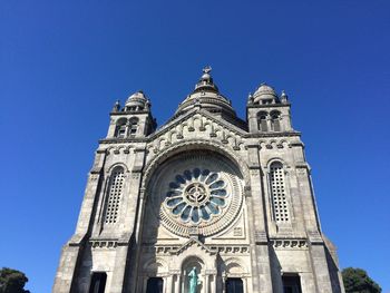 Low angle view of cathedral against clear blue sky