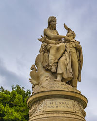 Low angle view of statue against sky