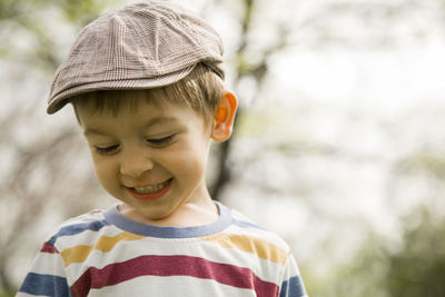 Close-up of boy wearing flat cap