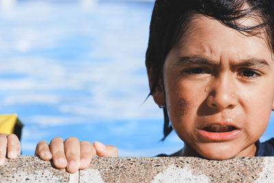 Close-up portrait of boy in swimming pool