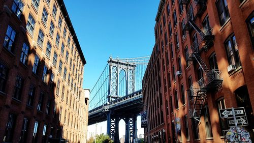 View of manhattan bridge - low angle view of buildings against sky