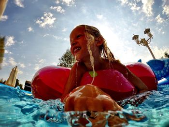 Portrait of young woman in swimming pool