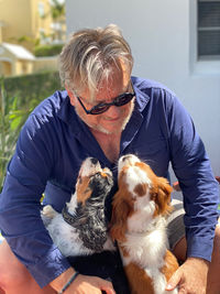 Midsection of man with dog