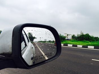 Reflection of car on road