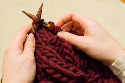 Cropped image of woman knitting wool