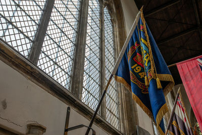 Low angle view of building seen through window