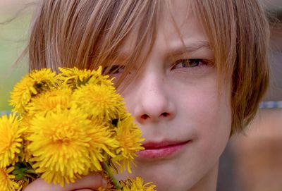 Close-up portrait of a girl with pink flower