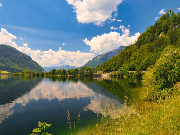 Scenic view of lake and mountains against sky