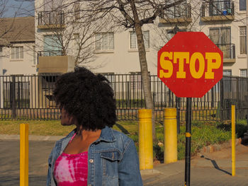 Woman with text written in city