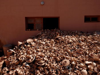 Stack of clay objects against wall