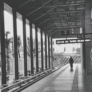 Man waiting at railroad station