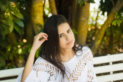 Young woman sitting outdoors