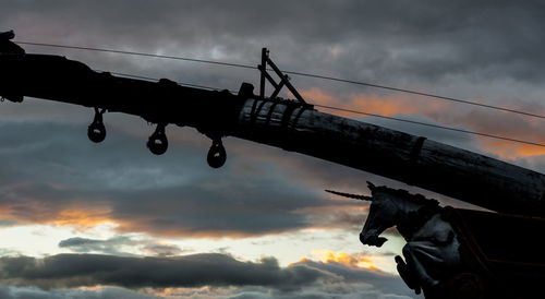 Low angle view of silhouette people against sky