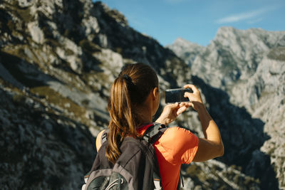 Midsection of woman photographing