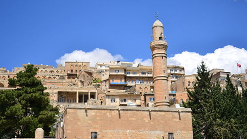 Low angle view of historic building against clear blue sky