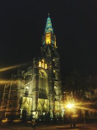 Low angle view of illuminated church at night