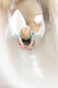 High angle view of boy playing with water