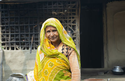 Portrait of a smiling indian woman in sari   rural india