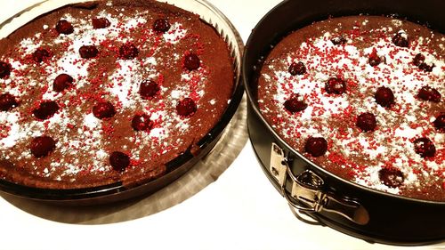 High angle view of plum cakes in container