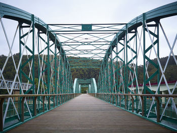 Footbridge against clear sky