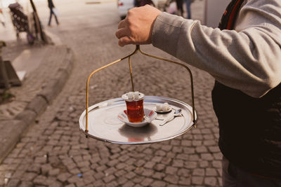 Close-up of hand holding drink