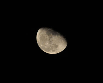 Low angle view of moon against clear sky at night