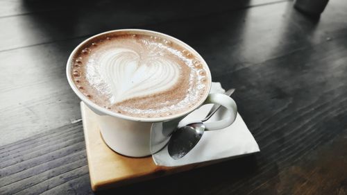 High angle view of cappuccino on table