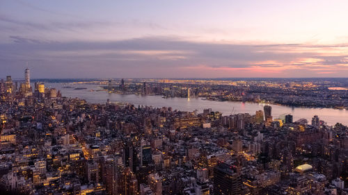 High angle view of buildings against sky during sunset