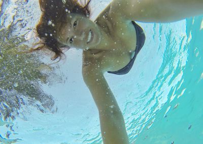 Full length of woman swimming in sea