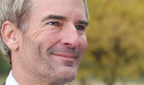 Close-up of smiling man looking away