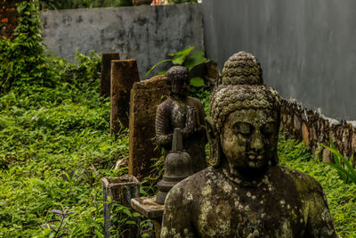 Old statue against temple
