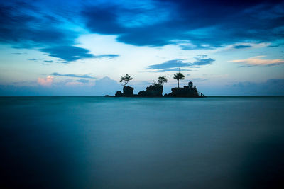 Scenic view of sea against sky at sunset