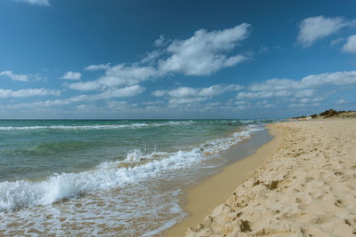 Scenic view of beach against sky