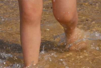 Low section of woman in water