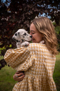 Rear view of woman with dog