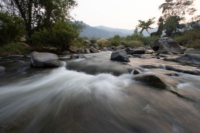 Scenic view of river stream against sky