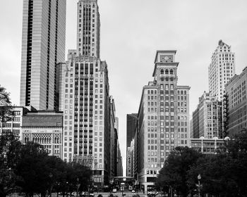 Low angle view of buildings against sky in city